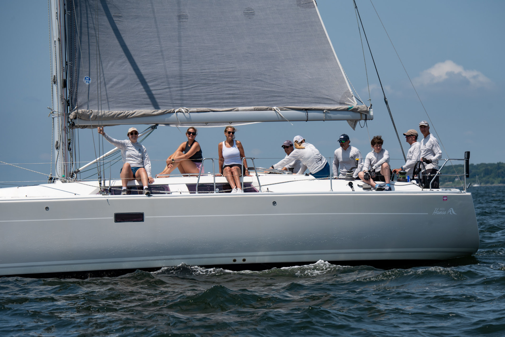 Guests sailing aboard a yacht on open water